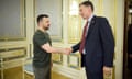 The Ukrainian president and UK finance minister shake hands