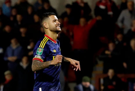 Bruno Guimaraes clenches his fists and winces after missing a penalty