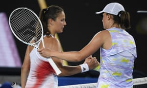 Iga Swiatek is congratulated by Daria Kasatkina of Russia