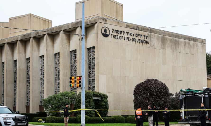 Police officers guard the Tree of Life synagogue following the shooting