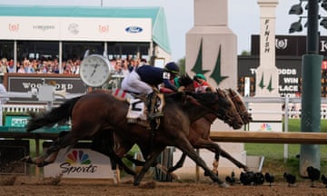 Mystik Dan, rear, with jockey Brian Hernandez Jr, crosses the finish line at Churchill Downs first ahead of Sierra Leone and Forever Young in the 150th running of the Kentucky Derby on Saturday.