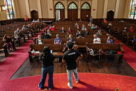 Common Cause organisers lead an election observer training session in church pews