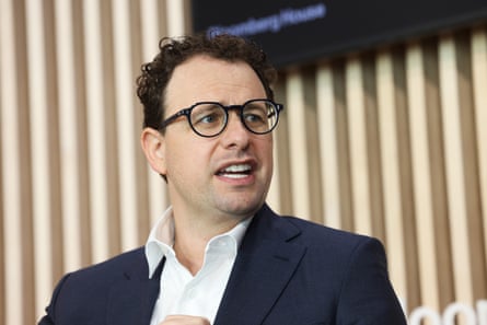 Man in glasses looks to side