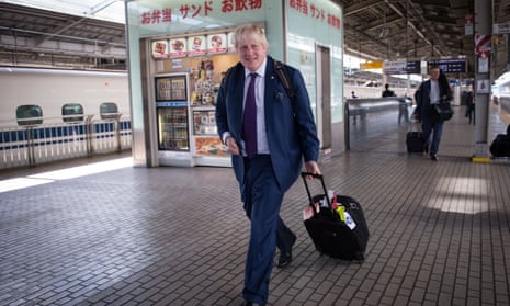 Boris Johnson  at Osaka railway station in Japan