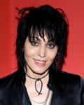 Photograph of Joan Jett with her distinctive shoulder length shaggy black hair with long fringe