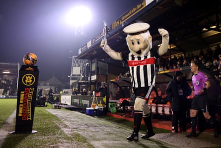 Grimsby’s mascot leads the teams out of the tunnel.