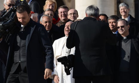 Pope Francis shares a joke in St Peter’s Square.