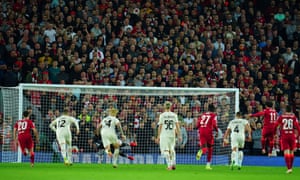 Milan keeper Mike Maignan saves a penalty from Mohamed Salah of Liverpool.