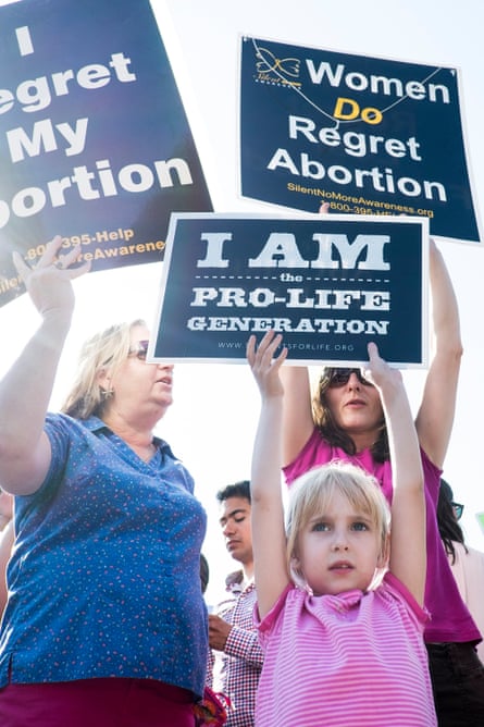 An anti-abortion activist demonstrates with her family outside the supreme court in Washington DC, on 27 June 2016.