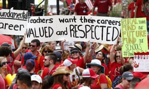 Thousands protest for higher teacher pay and school funding on 26 April in Phoenix.
