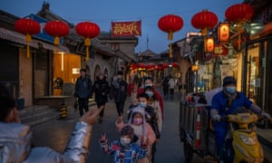 People take pictures with lanterns and decorations for the upcoming Lunar New Year in the historical centre of Beijing on 27 January 2022 in Beijing, China.