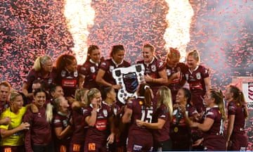 Ali Brigginshaw and her Queensland teammates celebrate with the Women’s State of Origin trophy