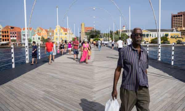 The Dutch-style architecture of Willemstad is a draw for the tourists who mingle unwittingly with Venezuelan migrants in Curaçao.