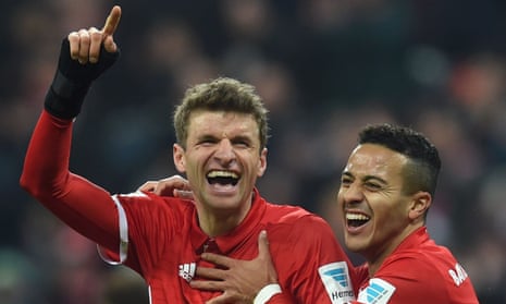 Thomas Müller celebrates with Thiago Alcântara after scoring Bayern Munich’s third goal in the 5-0 win against Wolfsburg.