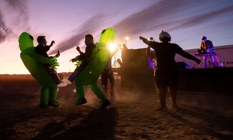 People in costume dance during a DJ set at ‘Alienstock’ in Rachel, Nevada.