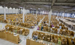 Boxes and parcels sit stacked in bays ahead of shipping from the warehouse of an Amazon.com Inc fulfilment centre in Koblenz, Germany