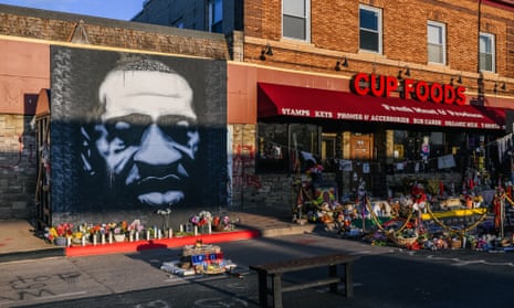 A mural of George Floyd is seen next to Cup Foods in Minneapolis, Minnesota, on 31 March. 