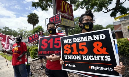 McDonald’s workers and labor activists protest to demand the company pays at least $15 an hour