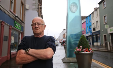 Kevin Skelton, whose wife, Philomena, was killed, stands near the Omagh memorial that marks the spot of the 1998 bombing