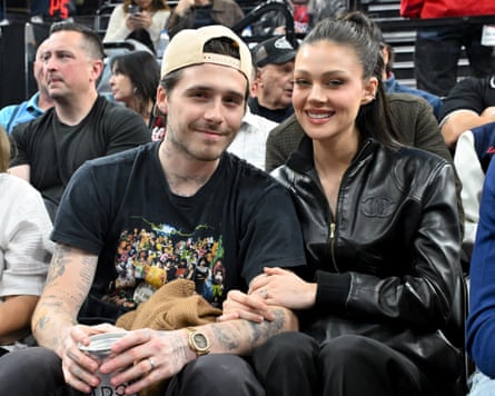Brooklyn Beckham and Nicola Peltz attend a basketball game