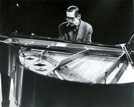 Black and white photo of a man playing piano