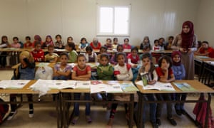 Teacher Hanan Anzi with Syrian refugee students  at one of the schools at Zaatari refugee camp