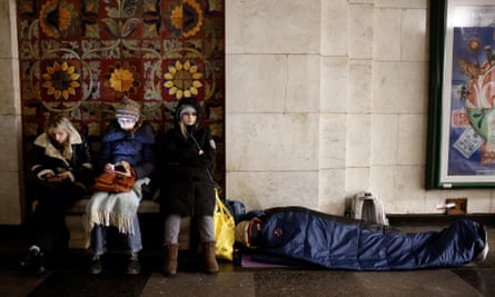 People take shelter in a metro station during the Russian missile attack in Kyiv