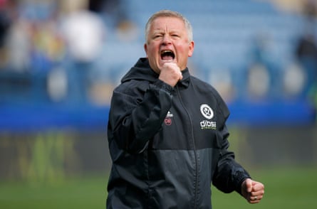 United manager Chris Wilder celebrates after their 4-2 win.