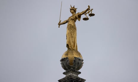 The statue of the Scales of Justice above the Old Bailey in London