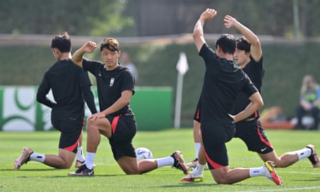 South Korea’s midfielder Hwang Hee-chan (2L) attends a training session at Al Egla Training Site 5 in Doha.