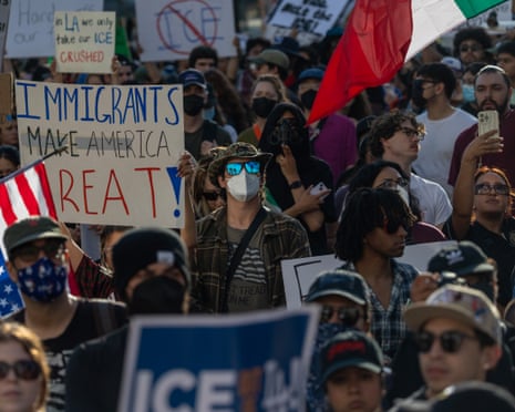 people protesting with signs and flags