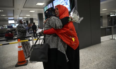 A woman hugs her daughter arriving from Somalia at Dulles international airport on 6 February. 