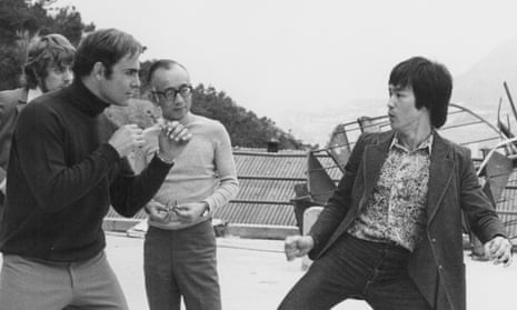 Raymond Chow with actors Bruce Lee and John Saxon on the set of Enter the Dragon in 1973. 