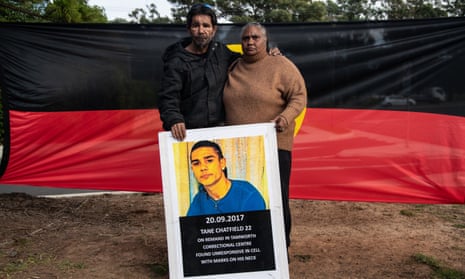 Tane Chatfield's parents Colin and Nioka Chatfield pose with a photograph of their son
