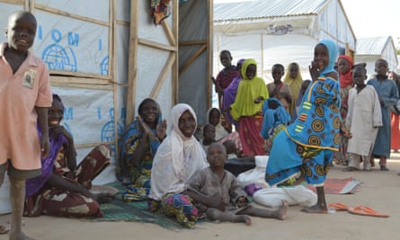 Displaced families outside shelters in Maiduguri.