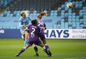 Lauren Hemp heads the opening goal.