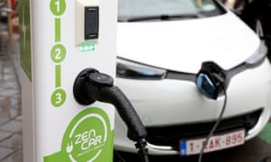 an electric car is charged up
