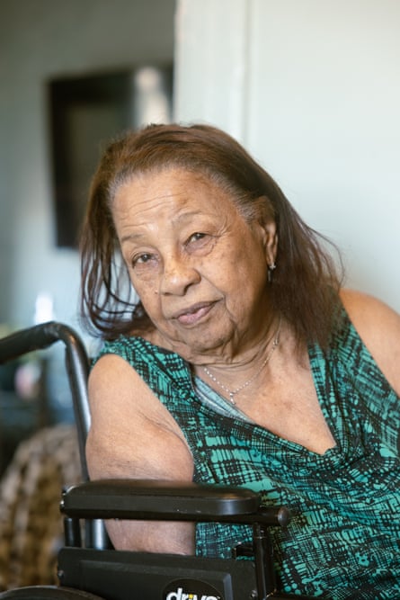 a woman poses for a portrait in her home