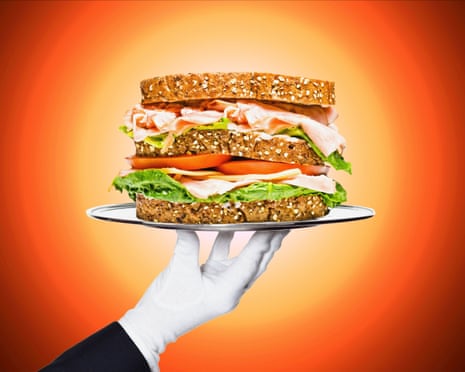 Composite of a white-gloved hand holding a ham salad sandwich on a platter