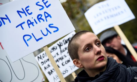 A women holds a placard