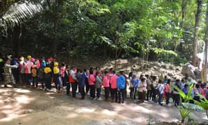 A queue of tourists waiting to visit the cave.