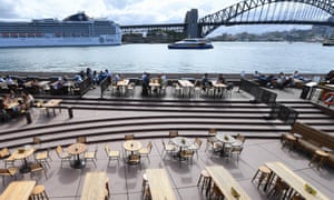 Empty tables at eateries near the Sydney Opera House on Tuesday as coronavirus restrictions bite. Retail and tourism workers are likely to have their incomes impacted in the coming weeks.