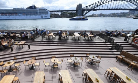 Empty tables at food and drink outlets at the Sydney Opera House