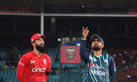 Moeen Ali of England and Babar Azam of Pakistan are seen at the toss.