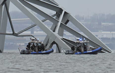 Police recovery crews work near the collapsed Francis Scott Key Bridge after it was struck by the container ship Dali in Baltimore, Maryland.