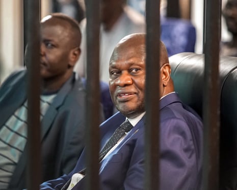 Riek Machar sits in the dock