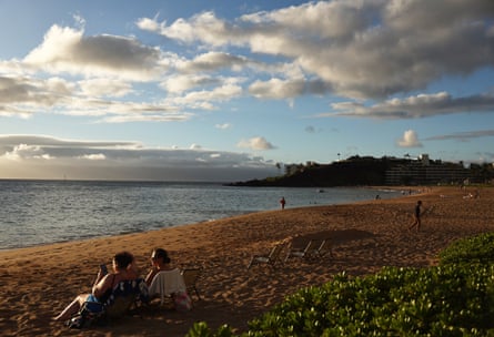 People gather on Kaanapali Beach near Lahaina on 5 August 2024.