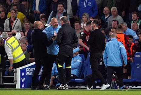 Manchester City manager Pep Guardiola holds assistant Rodolfo Borrell back from the fourth official Graham Scott after Erling Haaland’s goal was disallowed for a foul.