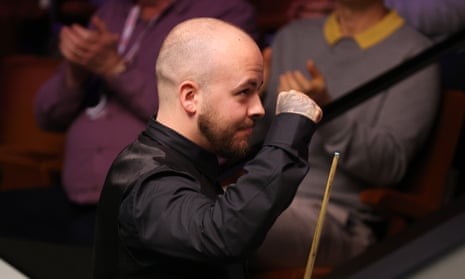 Luca Brecel celebrates victory against Ronnie O'Sullivan at the Crucible.