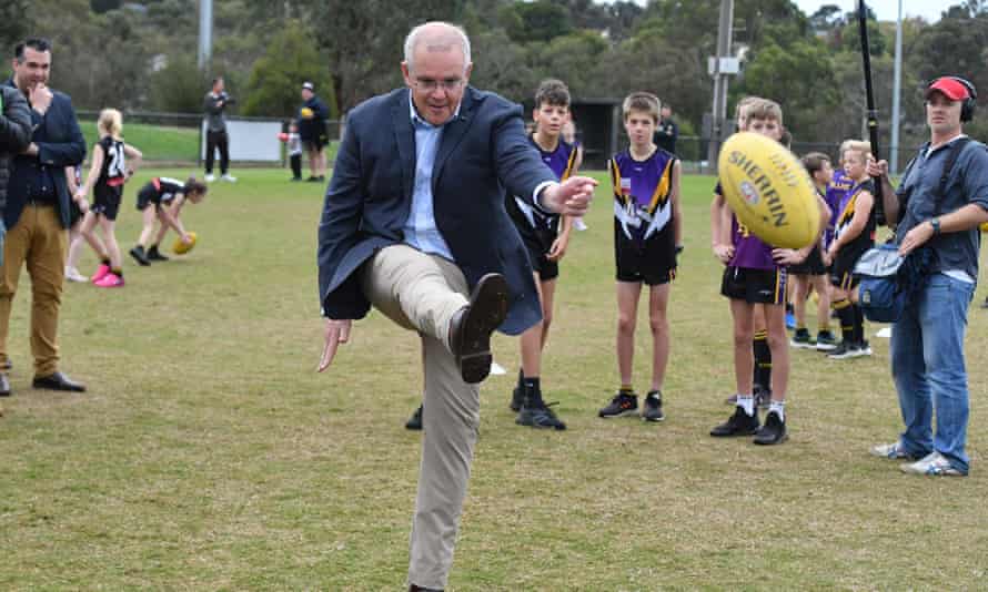 Prime Minister Scott Morrison kicks a ball at Norwood Sports Club on Day 34 of the 2022 federal election campaign, in Norwood in Melbourne, in the seat of Deakin. Saturday, May 14, 2022. (AAP Image/Mick Tsikas)